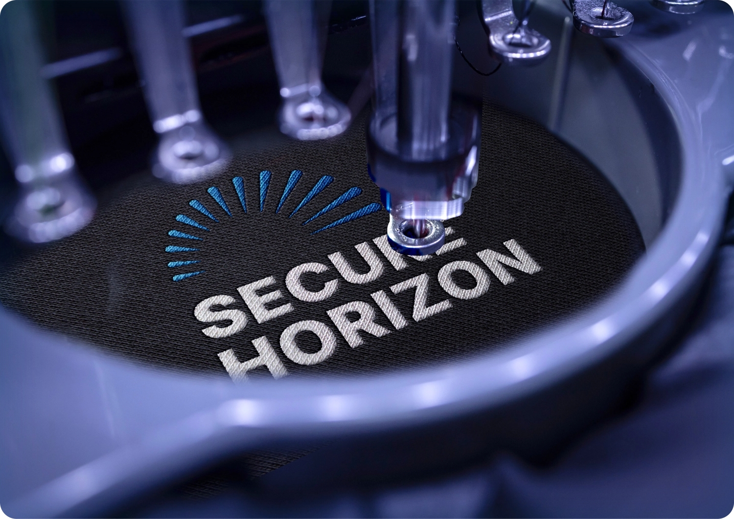 image of secure horizon logo being embroidered onto fabric